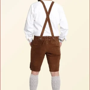 Iconic German outfits include lederhosen for men and dirndls for women, both of which are traditional Bavarian clothing often worn at cultural events and festivals.